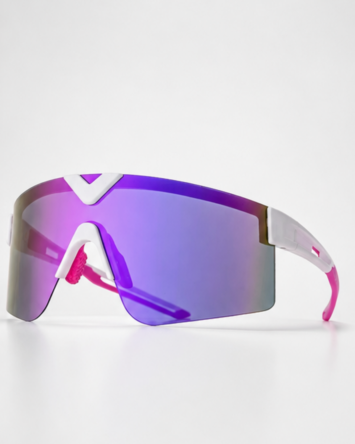 Surfside light-adaptive sunglasses in white and pink, three-quarter view of the one-piece purple mirror shield lens