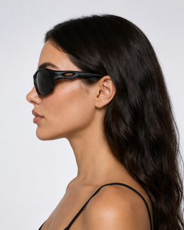 Profile of a woman wearing Coral Gables sport sunglasses, temple following the head without pressure