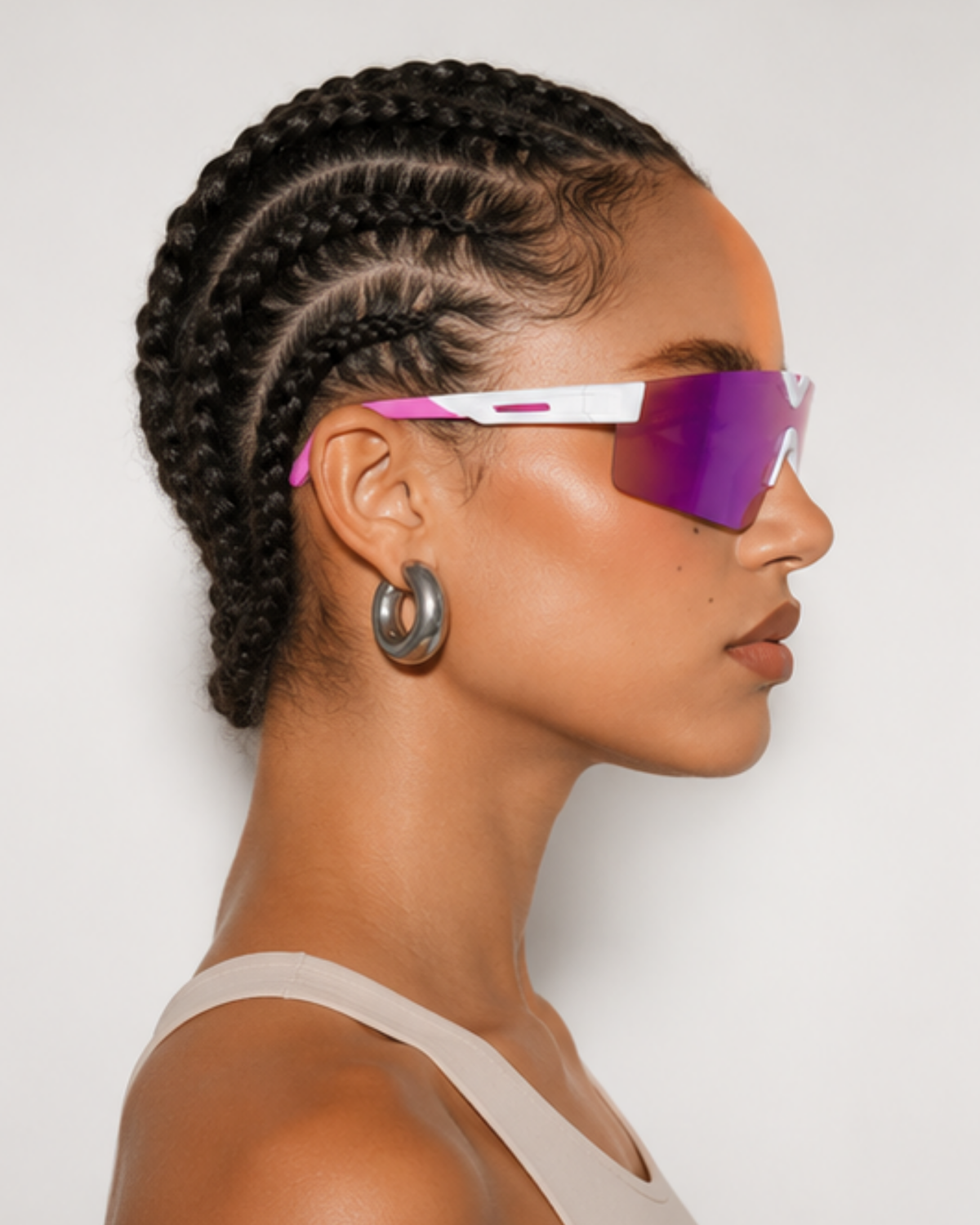 Profile of a woman wearing Surfside light-adaptive sunglasses, shield wrapping past the eye corner